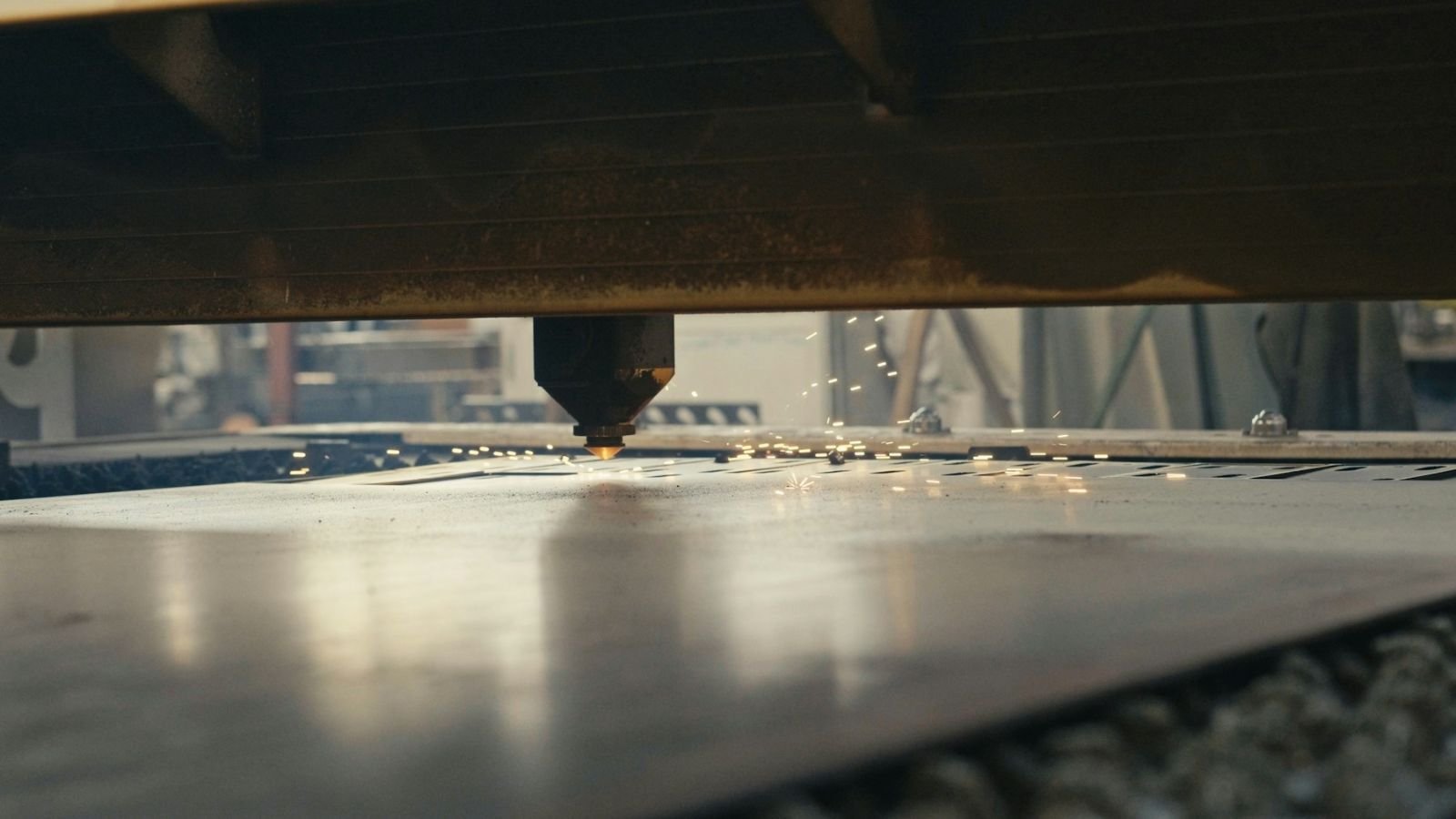 Laser working on a metal sheet